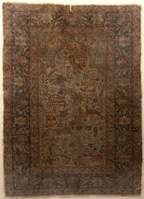 Lot 184 - An antique Persian rug decorated with flora...