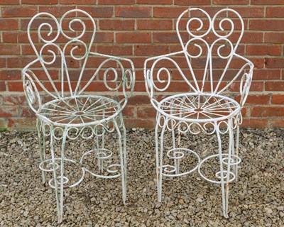 Lot 1361 - A pair of wrought iron garden chairs