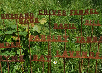 Lot 1337 - A set of twelve steel herb markers