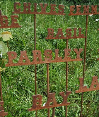 Lot 1337 - A set of twelve steel herb markers