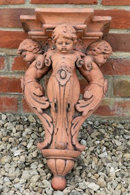 Lot 1267 - A terracotta coloured corbel