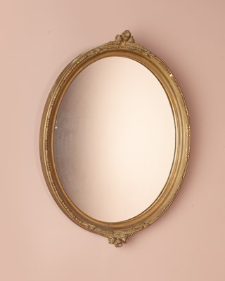 Lot 30 - A gilt oval framed wall mirror