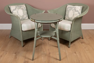 Lot 1212 - A pair of Lloyd Loom chairs and a matching circular table