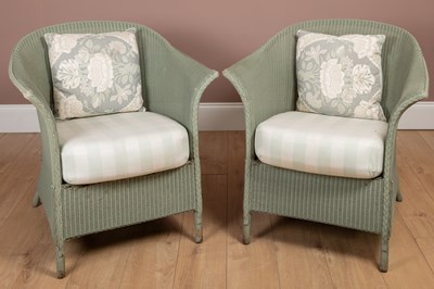 Lot 1212 - A pair of Lloyd Loom chairs and a matching circular table