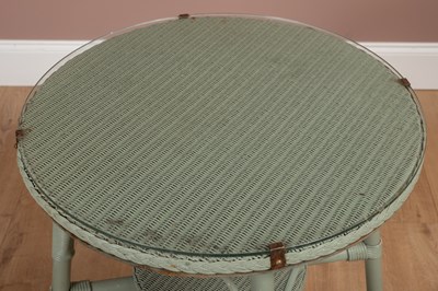 Lot 1212 - A pair of Lloyd Loom chairs and a matching circular table