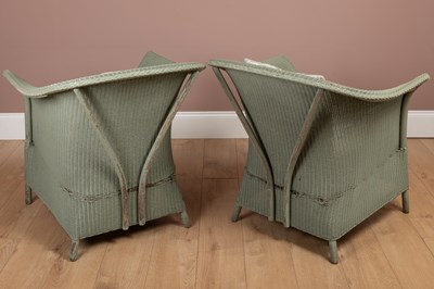 Lot 1212 - A pair of Lloyd Loom chairs and a matching circular table