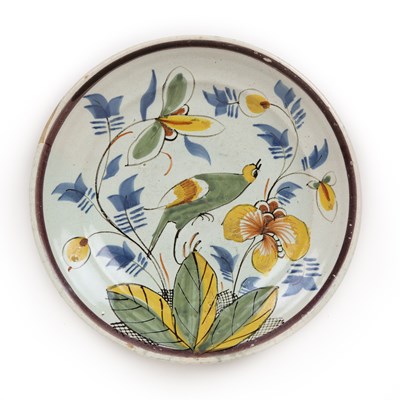 Lot 206 - An 18th century Dutch Delft charger, decorated...