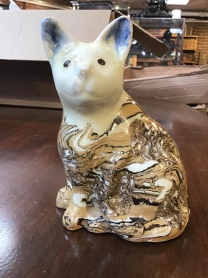 Lot 216 - A 19th century agate ware pottery cat, with...