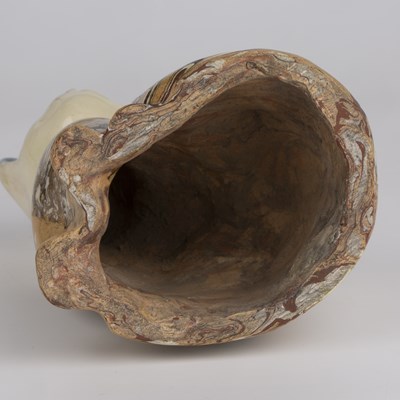 Lot 216 - A 19th century agate ware pottery cat, with...