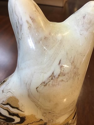 Lot 216 - A 19th century agate ware pottery cat, with...