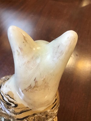 Lot 216 - A 19th century agate ware pottery cat, with...