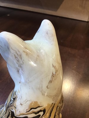 Lot 216 - A 19th century agate ware pottery cat, with...