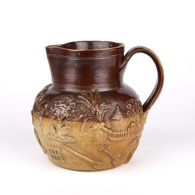 Lot 218 - An early 19th century stoneware harvest jug in...