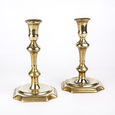 Lot 221 - A pair of George II brass candlesticks circa...