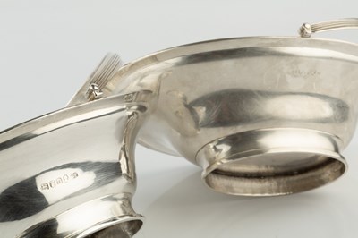 Lot A pair of George III silver swing handled oval...