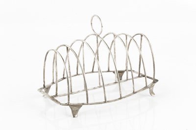 Lot 303 - A George III silver seven bar toast rack, of...