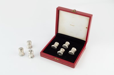 Lot A set of four sterling silver peppers by...