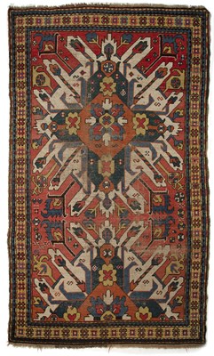 Lot 256 - An early 20th century star Kazak rug with...