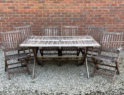 Lot 1347 - A rectangular teak garden table and six matching chairs