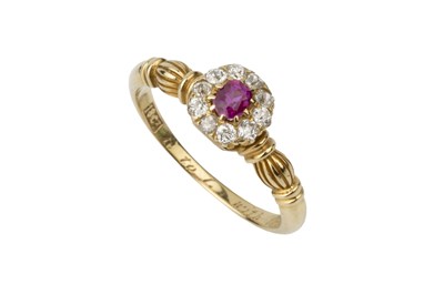 Lot A ruby and diamond cluster ring, the central...