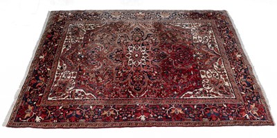 Lot 375 - A 20th century hand woven Heriz style rug