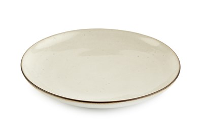 Lot 592 - Lucie Rie (1902-1995) Dish cream glaze with...