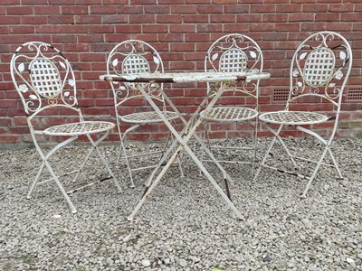 Lot 1228 - A white painted garden circular table and four matching chairs