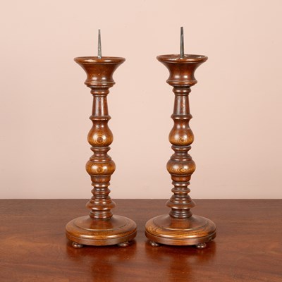 Lot 225 - A pair of turned ash pricket candlesticks