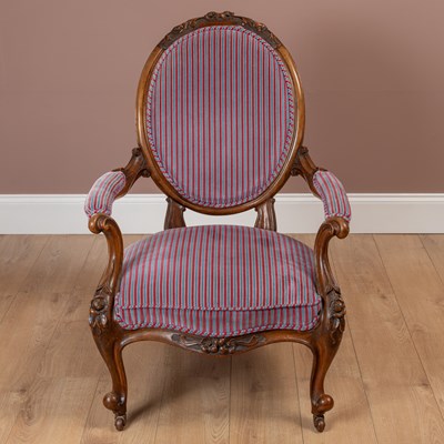 Lot 113 - A French style oval backed walnut framed armchair