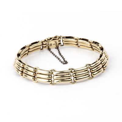 Lot 220 - Precious yellow metal bracelet with three bar...