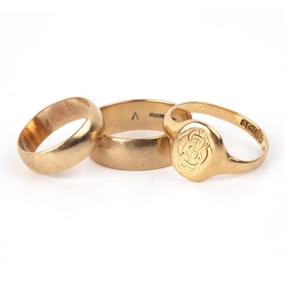 Lot 221 - Group of three gold rings comprising of an...