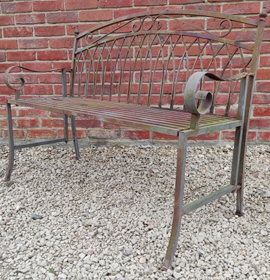 Lot 1324 - A wrought iron garden bench