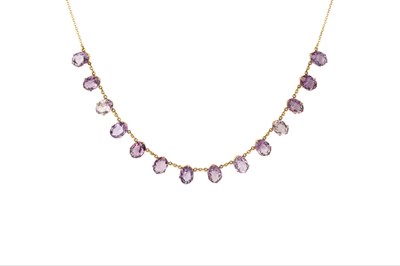 Lot 283 - An amethyst fringe necklace, the trace-link...