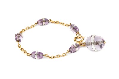 Lot 99 - An amethyst and rock crystal fancy bead-link...