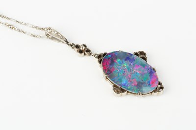 Lot 278 - An opal doublet and diamond pendant, white...
