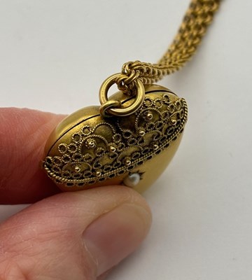 Lot 11 - A Victorian heart-shaped locket pendant, with...