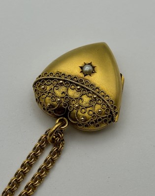 Lot 11 - A Victorian heart-shaped locket pendant, with...