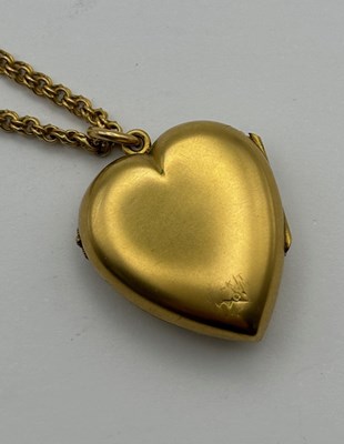 Lot 11 - A Victorian heart-shaped locket pendant, with...