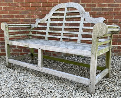 Lot 1352 - A Lutyens style teak garden bench