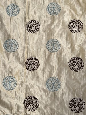 Lot 1108 - A pair of lined cream silk curtains