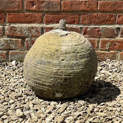 Lot 1243 - An old stone sphere