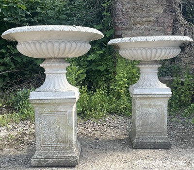 Lot 1348 - A pair of campana urns on plinth bases