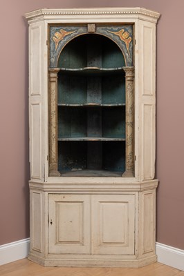 Lot 1162 - A Georgian and later painted pine corner cupboard