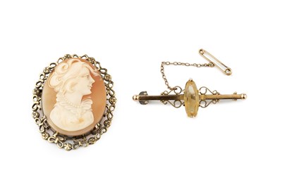 Lot 77 - A 15ct gold and citrine bar brooch, the...