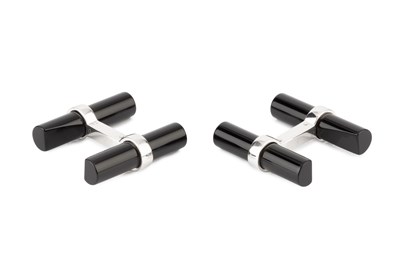 Lot 201 - A pair of black onyx baton cufflinks by...