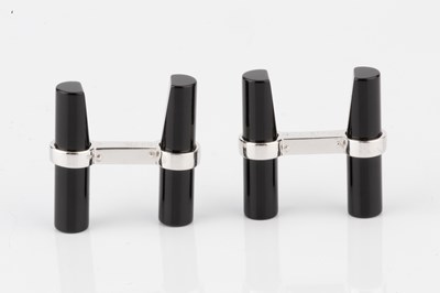 Lot 201 - A pair of black onyx baton cufflinks by...