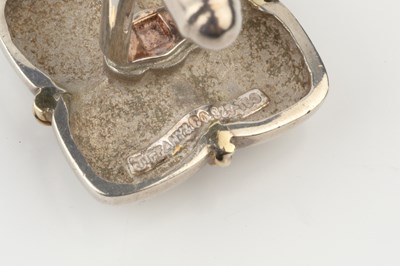 Lot A pair of silver cufflinks by Tiffany & Co.,...