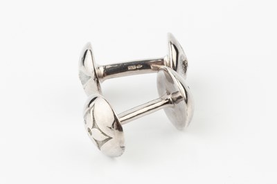 Lot A pair of silver cufflinks by Louis Vuitton,...