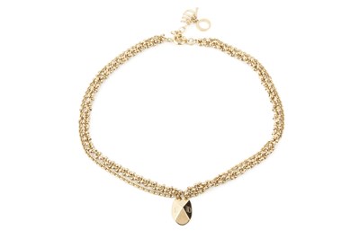 Lot 105 - A gold plated multi-strand necklace by...