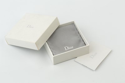 Lot 106 - A paste set charm bracelet by Christian Dior,...